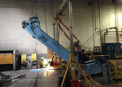 Removing a heat treating conveyor system for belt replacement