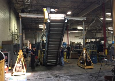 Removing a heat treating conveyor system for belt replacement