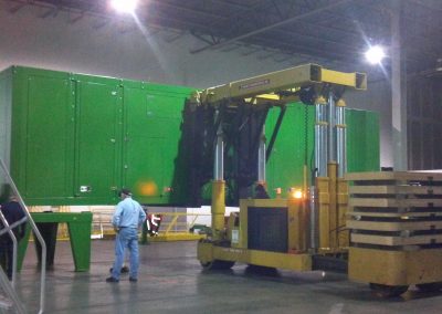 Setting a 55,000 lbs Blue Box Recycler onto frame with our 50 Ton Tri-lifter