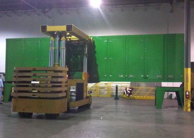 Setting a 55,000 lbs Blue Box Recycler onto frame with our 50 Ton Tri-lifter