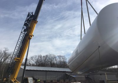 Unloading and placing water storage tank