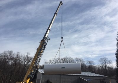 Unloading and placing water storage tank